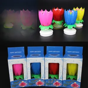 Detail of music lotus flower candles in four colors with packaging for birthday party