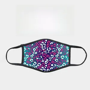 Detail view of the ear-loop design on a tie-dye leopard print protective face mask
