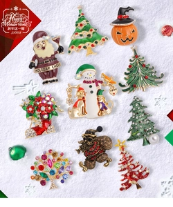 Detailed flat lay of Christmas brooches with pearls and rhinestones on snow background