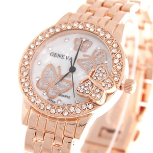 Detail of rose gold watch dial featuring crystal butterflies and rhinestone bezel