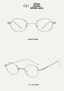 Detail view of oval silver sunglasses featuring intricate cross pattern engraving on the temple