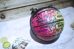 Detail of colorful graffiti basketball bag with pink gradient and leather texture