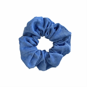 Blue corduroy velvet scrunchie ponytail holder accessory with soft ribbed fabric texture