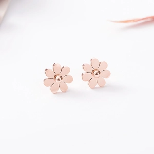 Elegant rose gold sunflower stud earrings with eight-petal daisy design on white background