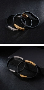 Detail view of woven leather men's bracelets with stainless steel clasps in black and gold