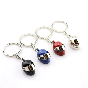 Creative motorcycle helmet keychains in black, blue, red, and silver with metal finish