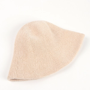 Detailed view of beige chenille bucket hat showing ribbed knit texture and soft fabric
