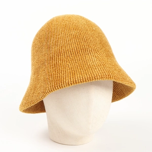 Close-up of ginger yellow chenille bucket hat texture on a white mannequin head