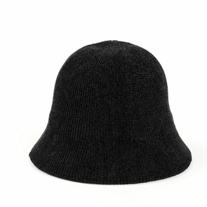 Close-up of thick textured chenille knit fabric on a solid black bucket hat for winter