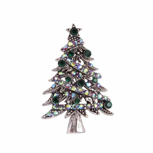Detailed view of silver Christmas tree brooch with sparkling green and colorful rhinestones