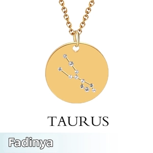 Detailed view of gold Taurus zodiac pendant necklace with inlaid crystal star pattern