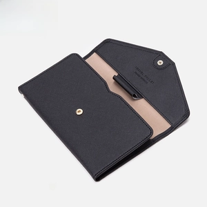 RFID blocking travel passport wallet in black cross-pattern leather with gold hardware