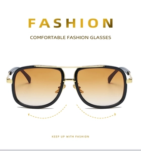 Detail view of large frame sunglasses featuring double bridge and gold metal accents