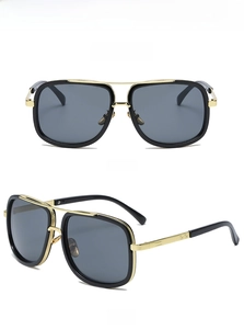 Front and 45-degree angle views of stylish black and gold oversized aviator sunglasses