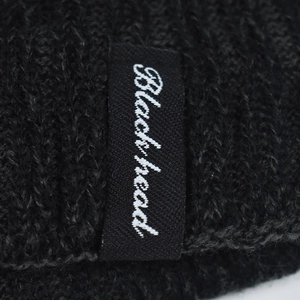 Winter chunky knit beanie in black with soft thermal fleece lining and a side logo label