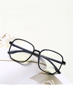 Detail view of stylish large black square eyeglass frames with anti-blue light lenses