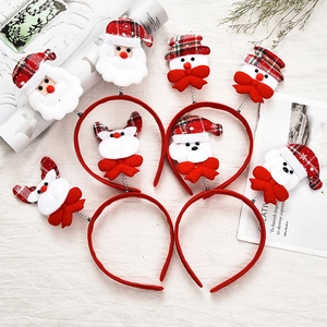 Christmas headband set with Santa and reindeer plush figures on white background