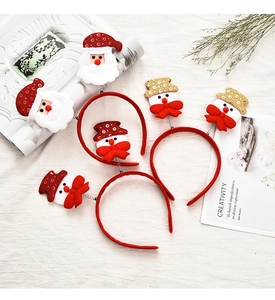 Detailed close-up of festive reindeer Christmas headbands with Santa and snowman figures
