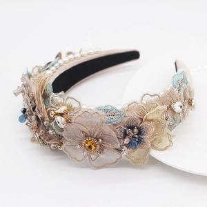 Macro detail of Baroque headband featuring lace floral embroidery with pearls and crystals