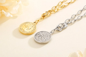 Macro detail of gold and silver coin pendant necklaces with queen portrait engraving