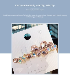 Macro shot of K9 crystal butterfly hair clip with champagne rhinestones and gold metal base
