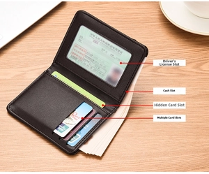 Detailed view of ultra-thin leather wallet with transparent ID window and card slots