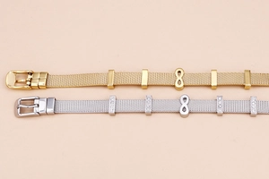 Detail of infinity charm bracelets with adjustable mesh bands in gold and silver finish