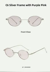 Close-up of silver metal oval sunglasses with detailed engravings on the temples