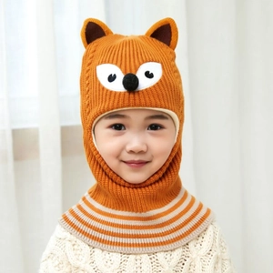 Close-up of orange fox knit hat for kids with soft 3D ears and earflaps for winter warmth