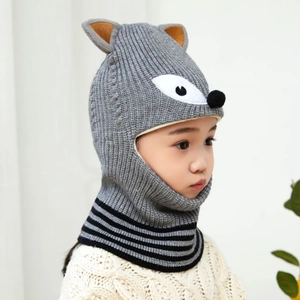 Close-up of children's grey fox knit hat with cute ears and warm integrated scarf