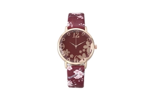 Detailed view of women's quartz watch with burgundy floral strap and rose gold bezel