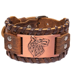 Men's brown leather wide cuff bracelet with bronze Celtic wolf head relief and buckle strap