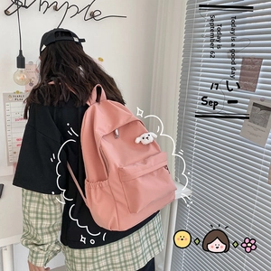 Zaino in nylon rosa impermeabile con ampio scomparto e ciondolo a forma di cane di peluche
