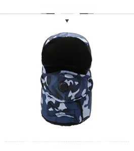 Close-up of winter camouflage trapper hat with breathing valve and thick fleece lining
