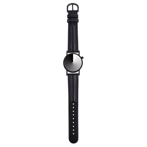 Close-up of a minimalist leather watch with a unique black and white split dial design