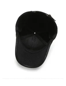 Detail view of winter baseball cap's breathable mesh lining and foldable earflaps