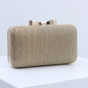 Elegant gold pleated evening clutch bag with glitter texture and metal bow clasp