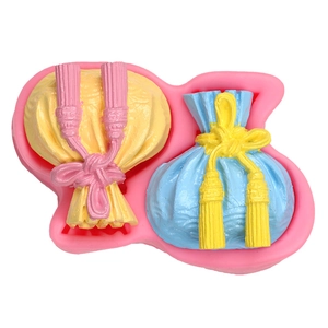 Pink silicone mold for DIY lucky bag handmade soaps and cake decorations with fabric texture
