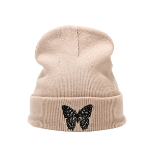 Winter beige knit beanie featuring detailed black butterfly embroidery and folded cuff