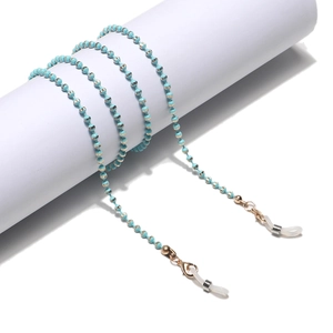 Detail of blue striped beads and gold chain link for sunglasses or face masks