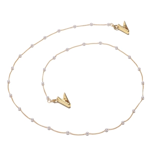 Faux pearl mask and glasses chain with golden alligator clips on a white background