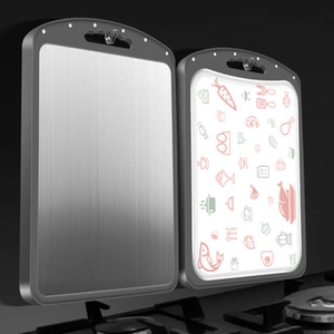 Dual-sided zinc alloy cutting board with brushed metal surface and food icons