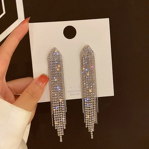 Detailed view of silver 925 tassel earrings featuring sparkling geometric crystal chains