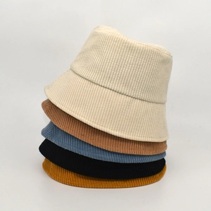 Solid color corduroy bucket hats for women shown in five different colors stacked