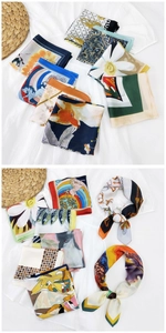 Dettaglio di foulard quadrati in seta stampata con motivi di volpe, cavallo e fiori