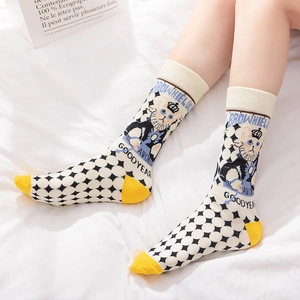 Mid-calf cotton socks with black checkerboard patterns and yellow heel contrast
