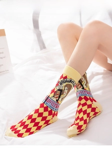 Close-up of 100% cotton socks with classic red and yellow argyle pattern and illustration