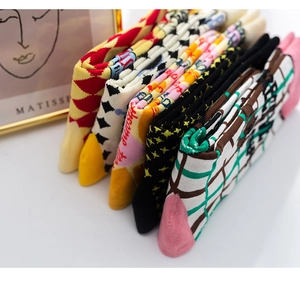 Detailed knit patterns of colorful cotton crew socks featuring diverse geometric jacquard art