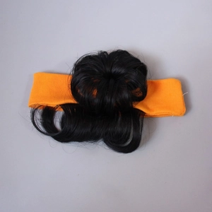 Detail of orange fabric headband with synthetic curly wig bun for baby girls