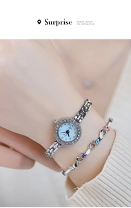Detail of luxury quartz watch with rhinestone bezel and colorful gemstone bracelet on wrist